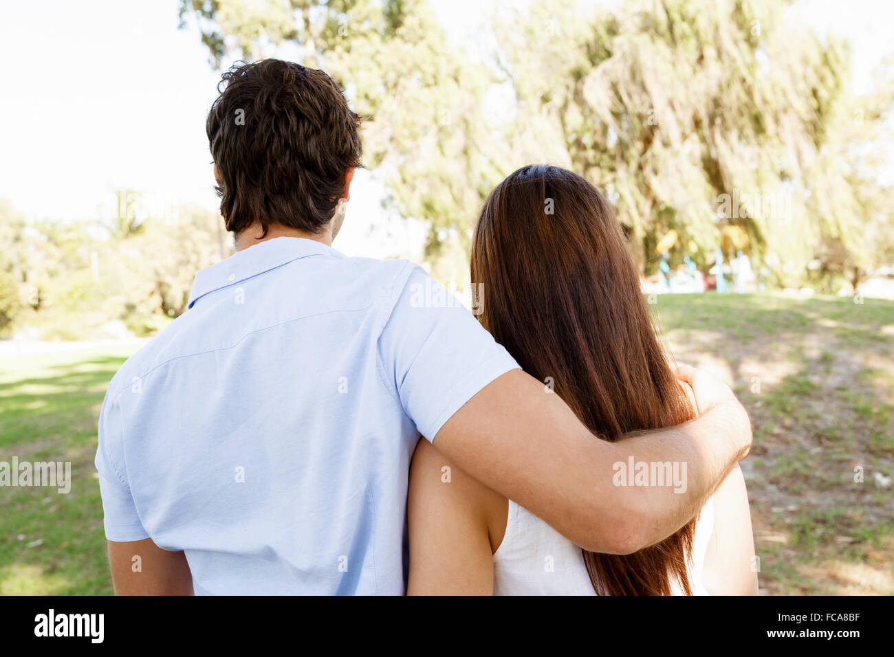Young happy couple in the park in the summer Stock Photo - Alamy