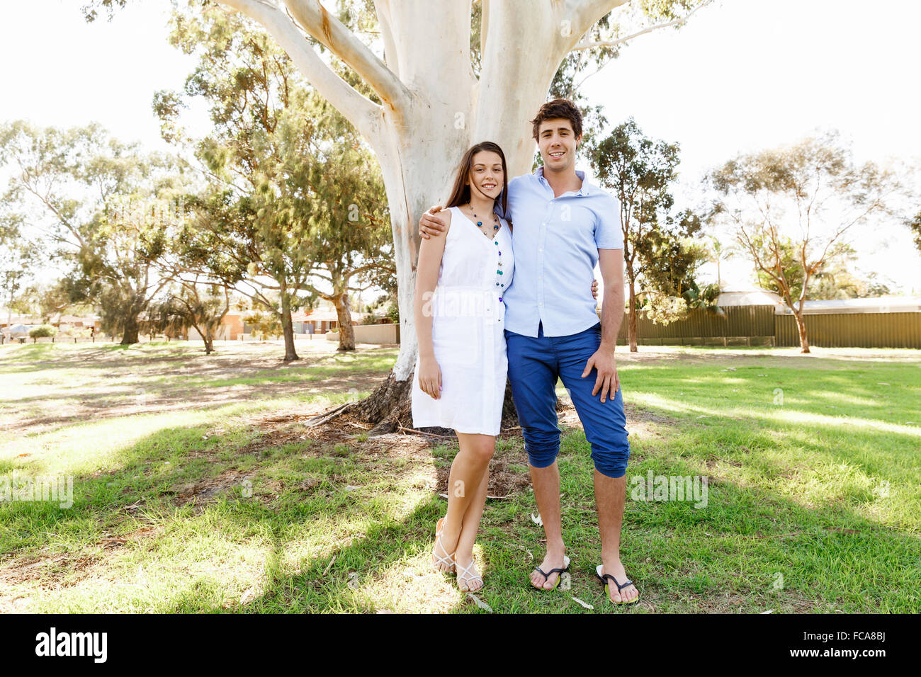 Young happy couple in the park in the summer Stock Photo - Alamy