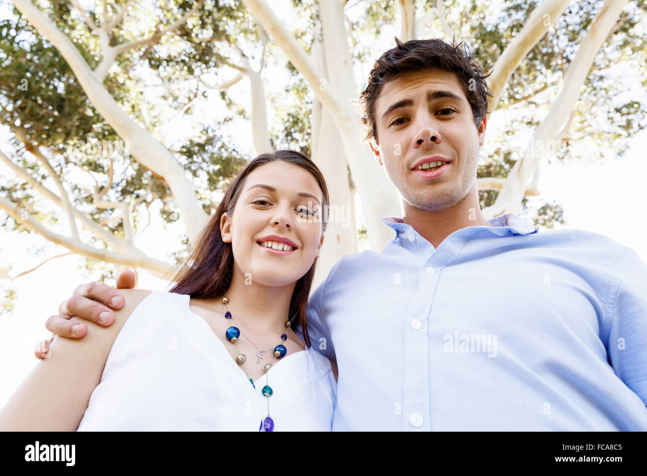 Young happy couple in the park in the summer Stock Photo - Alamy
