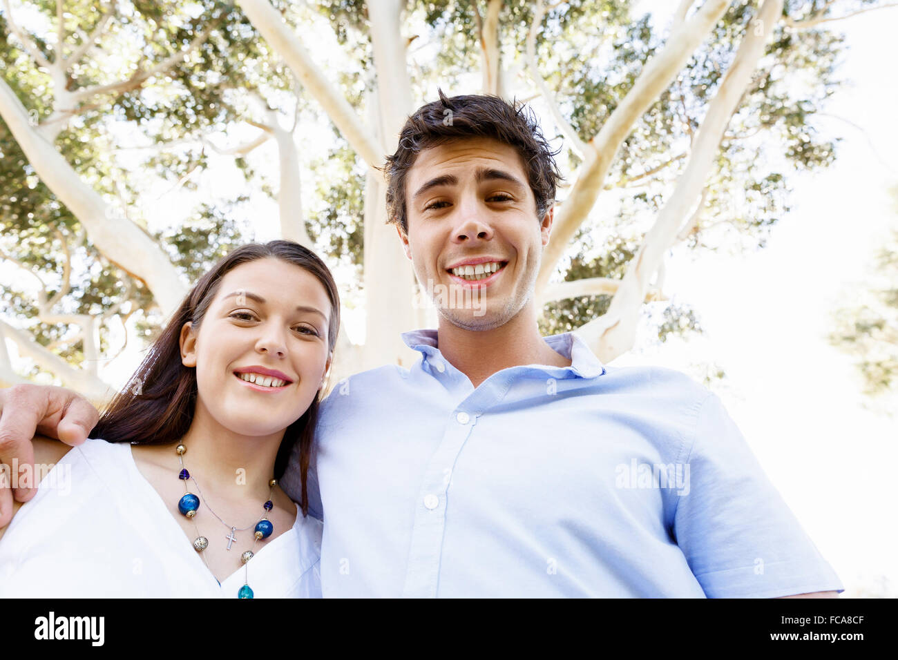 Young happy couple in the park in the summer Stock Photo - Alamy