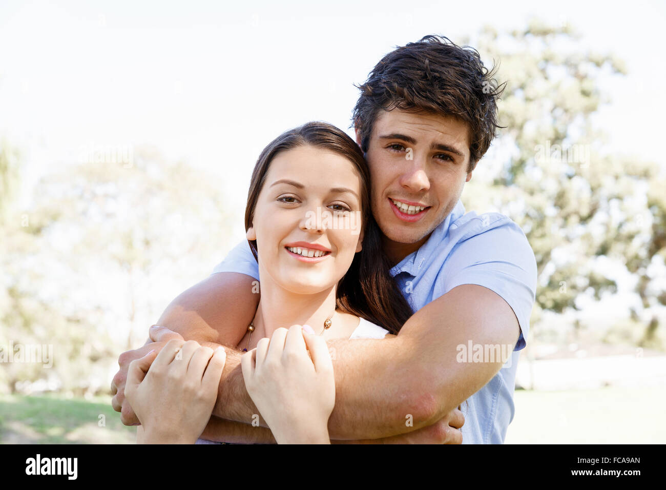 Young happy couple in the park in the summer Stock Photo - Alamy