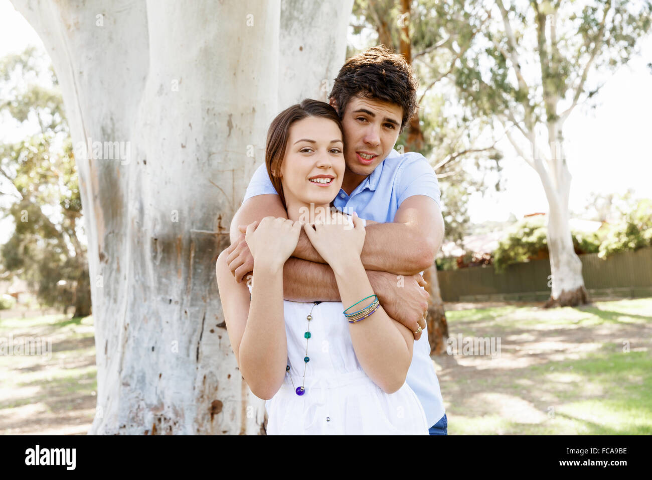 Young happy couple in the park in the summer Stock Photo - Alamy