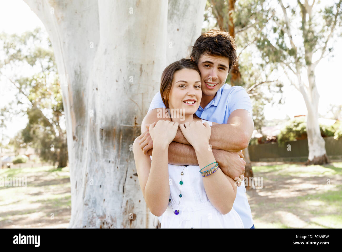 Young happy couple in the park in the summer Stock Photo - Alamy