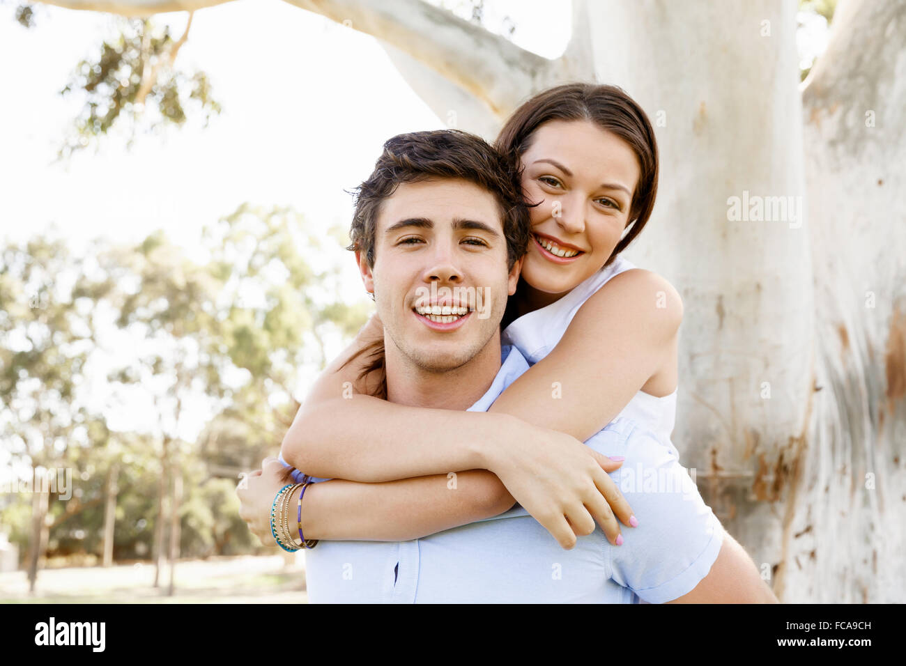 Young happy couple in the park in the summer Stock Photo - Alamy