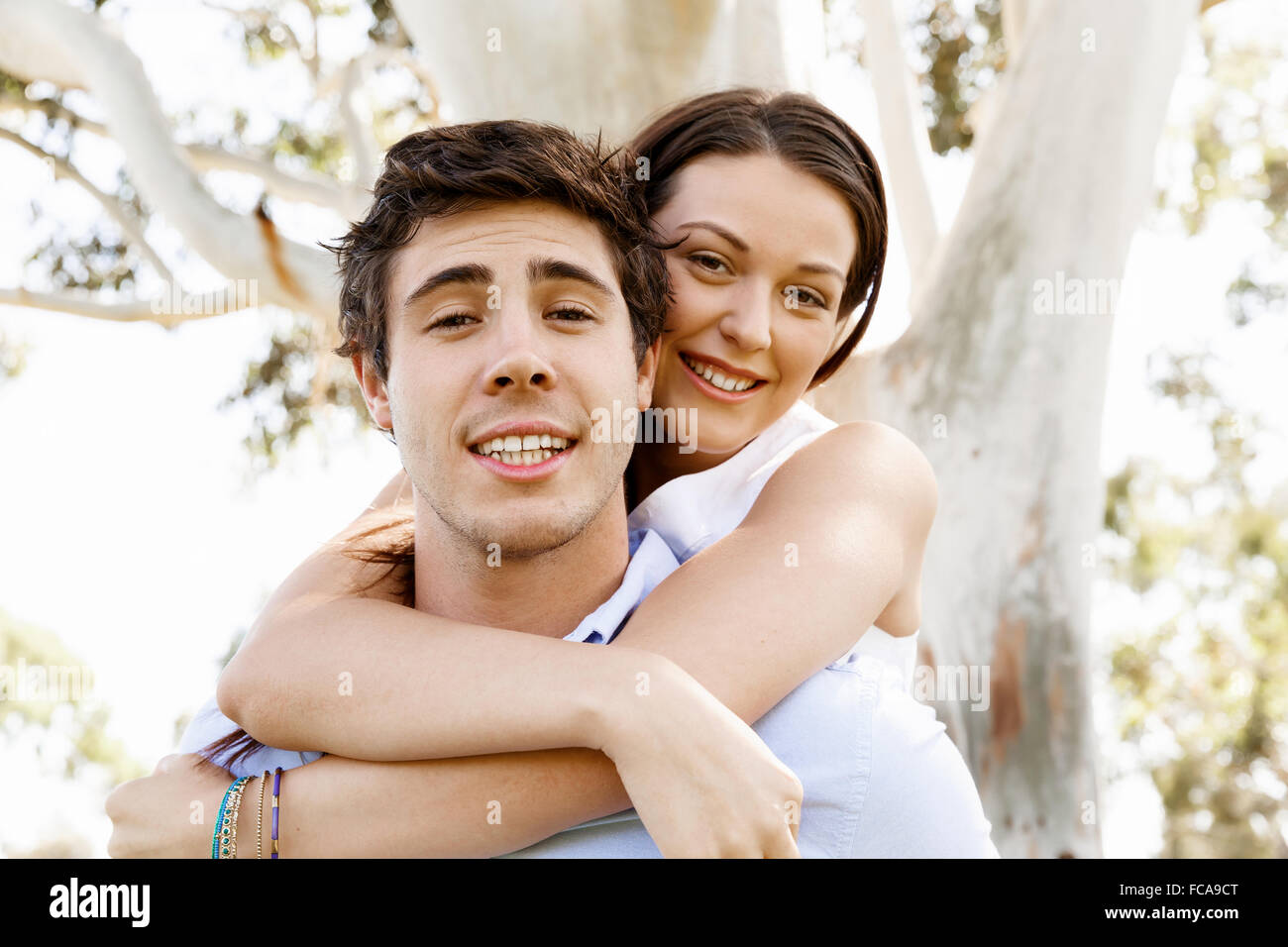 Young happy couple in the park in the summer Stock Photo - Alamy