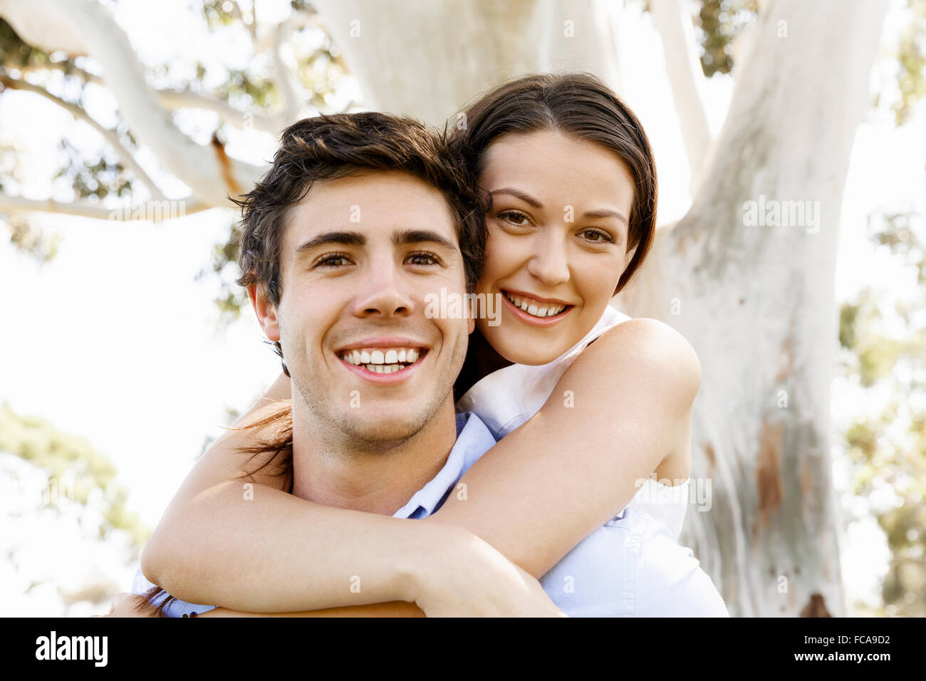 Young happy couple in the park in the summer Stock Photo - Alamy