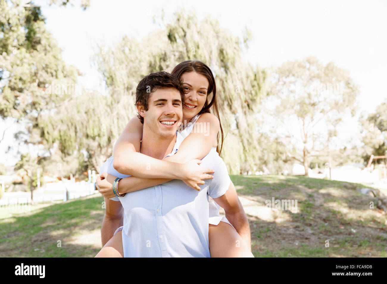 Young happy couple in the park in the summer Stock Photo - Alamy