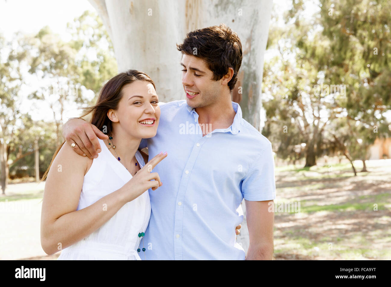 Young happy couple in the park in the summer Stock Photo - Alamy
