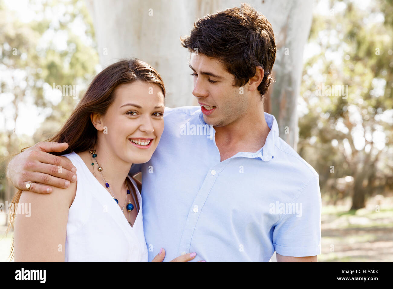 Young happy couple in the park in the summer Stock Photo - Alamy