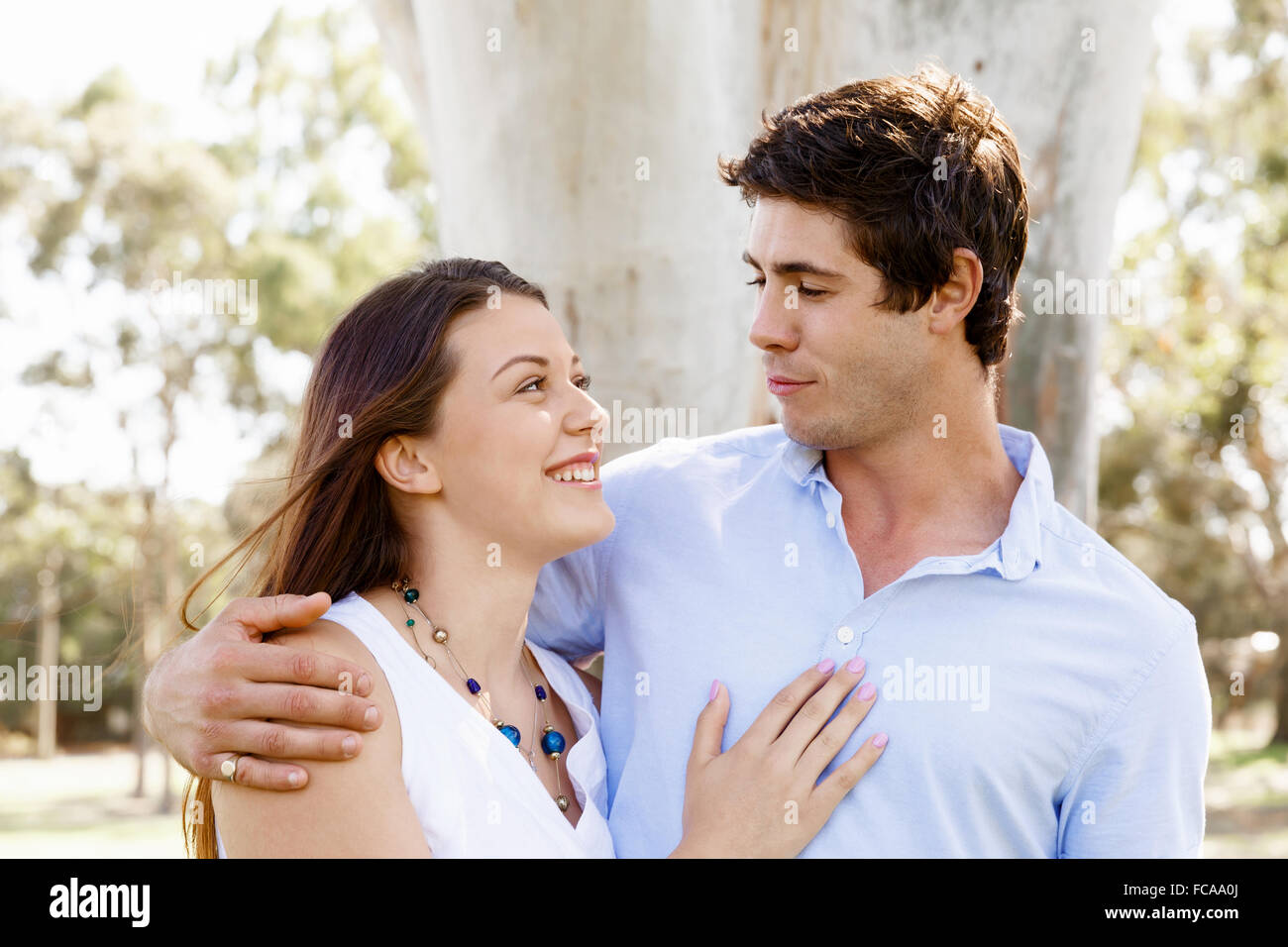 Young happy couple in the park in the summer Stock Photo - Alamy