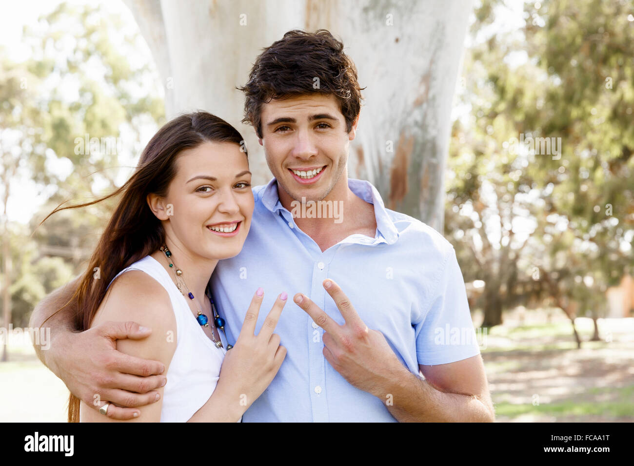 Young happy couple in the park in the summer Stock Photo - Alamy