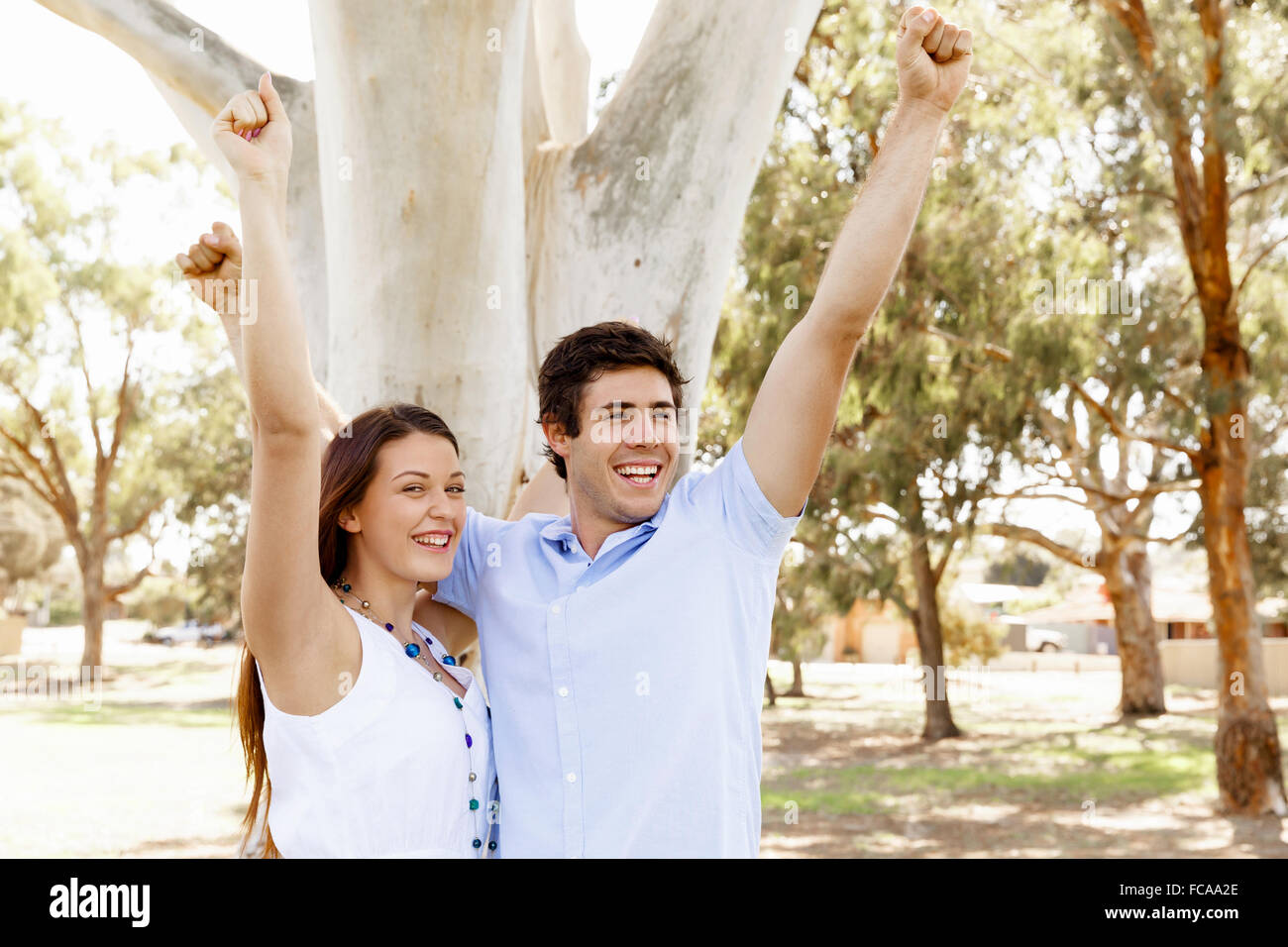 Young happy couple in the park in the summer Stock Photo - Alamy