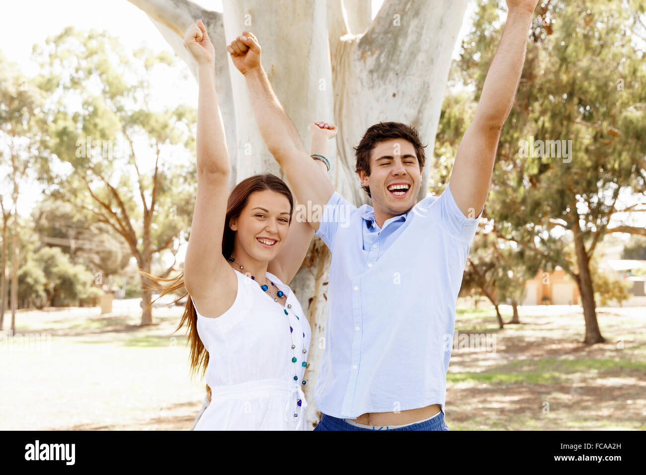 Young happy couple in the park in the summer Stock Photo - Alamy