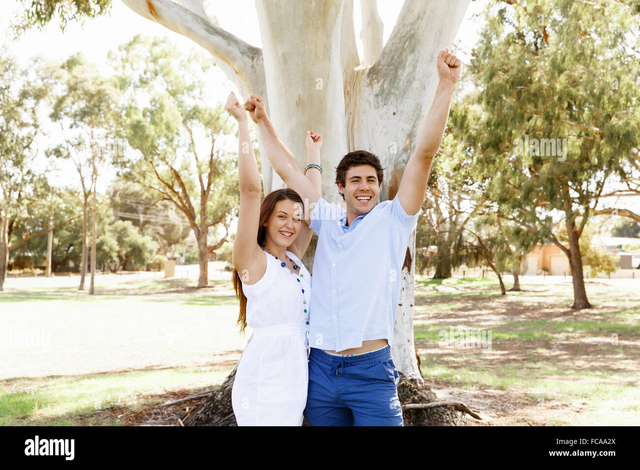 Young happy couple in the park in the summer Stock Photo - Alamy