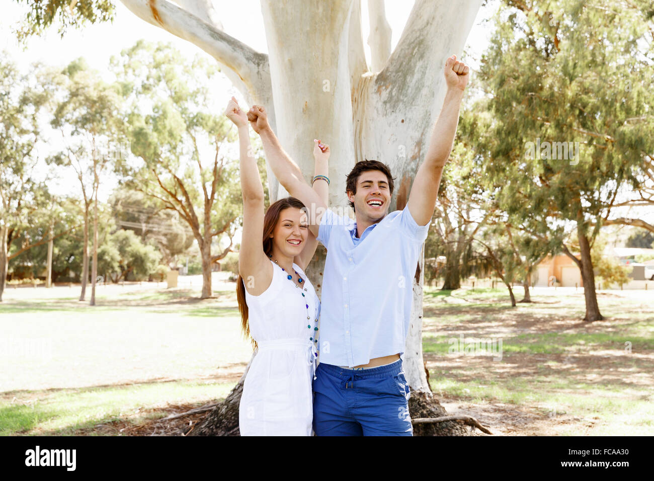 Young happy couple in the park in the summer Stock Photo - Alamy