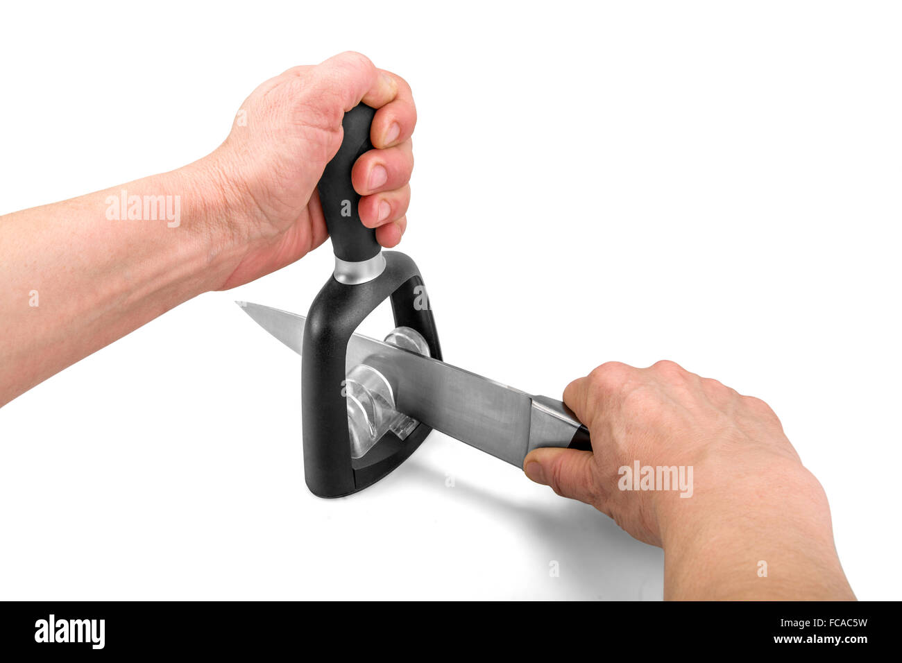 Knife hand sharpening technique - isolated on white with clipping path Stock Photo