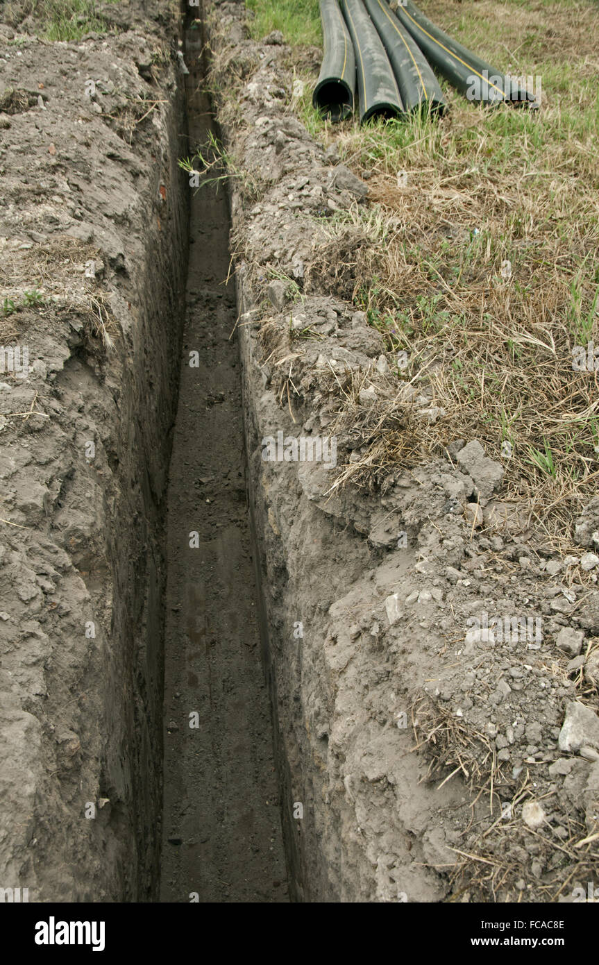 Plastic pipes in a ditch Stock Photo Alamy