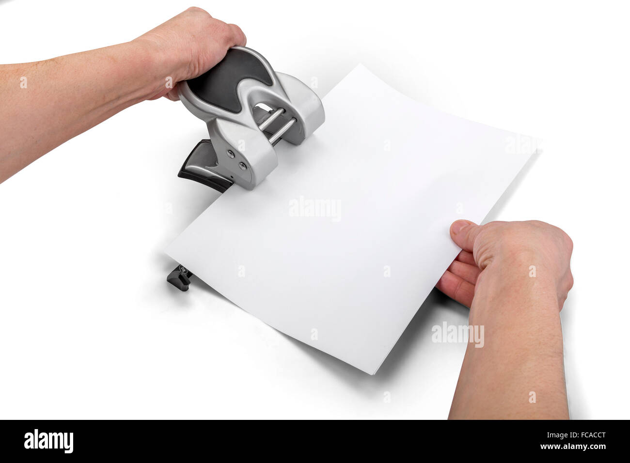 Office paper perforator and hands isolated on white with clipping path Stock Photo
