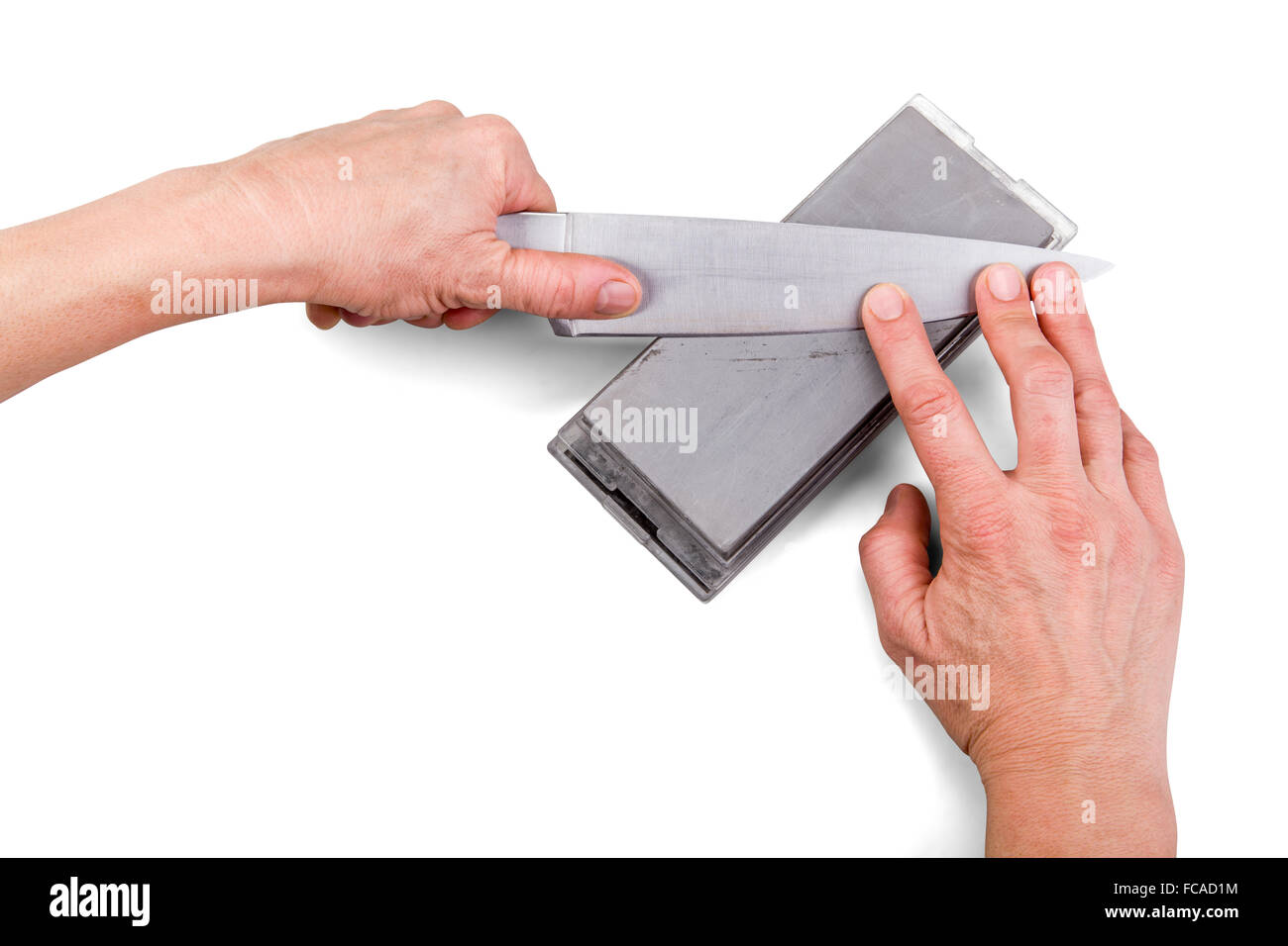 Knife hand sharpening technique isolated on white with clipping path