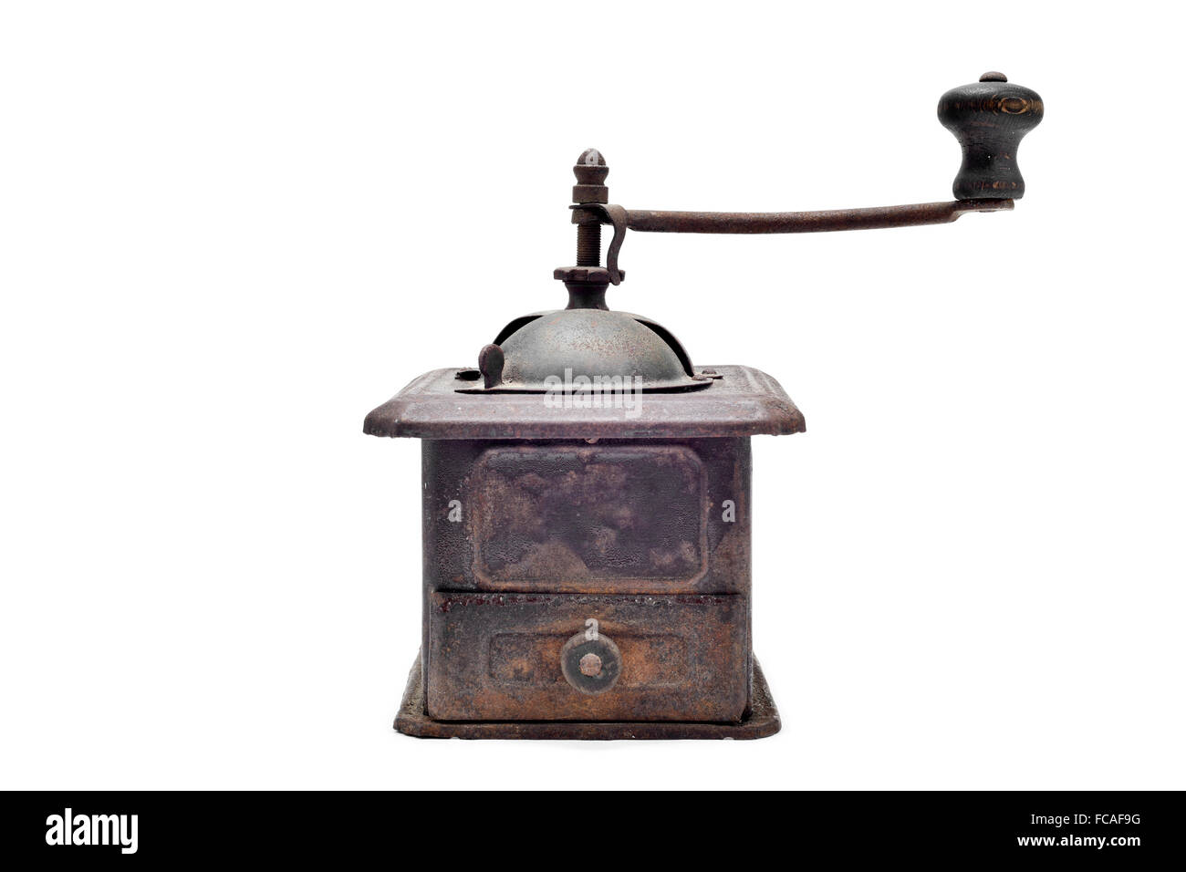 an old and rusty manual burrmill coffee grinder on a white background