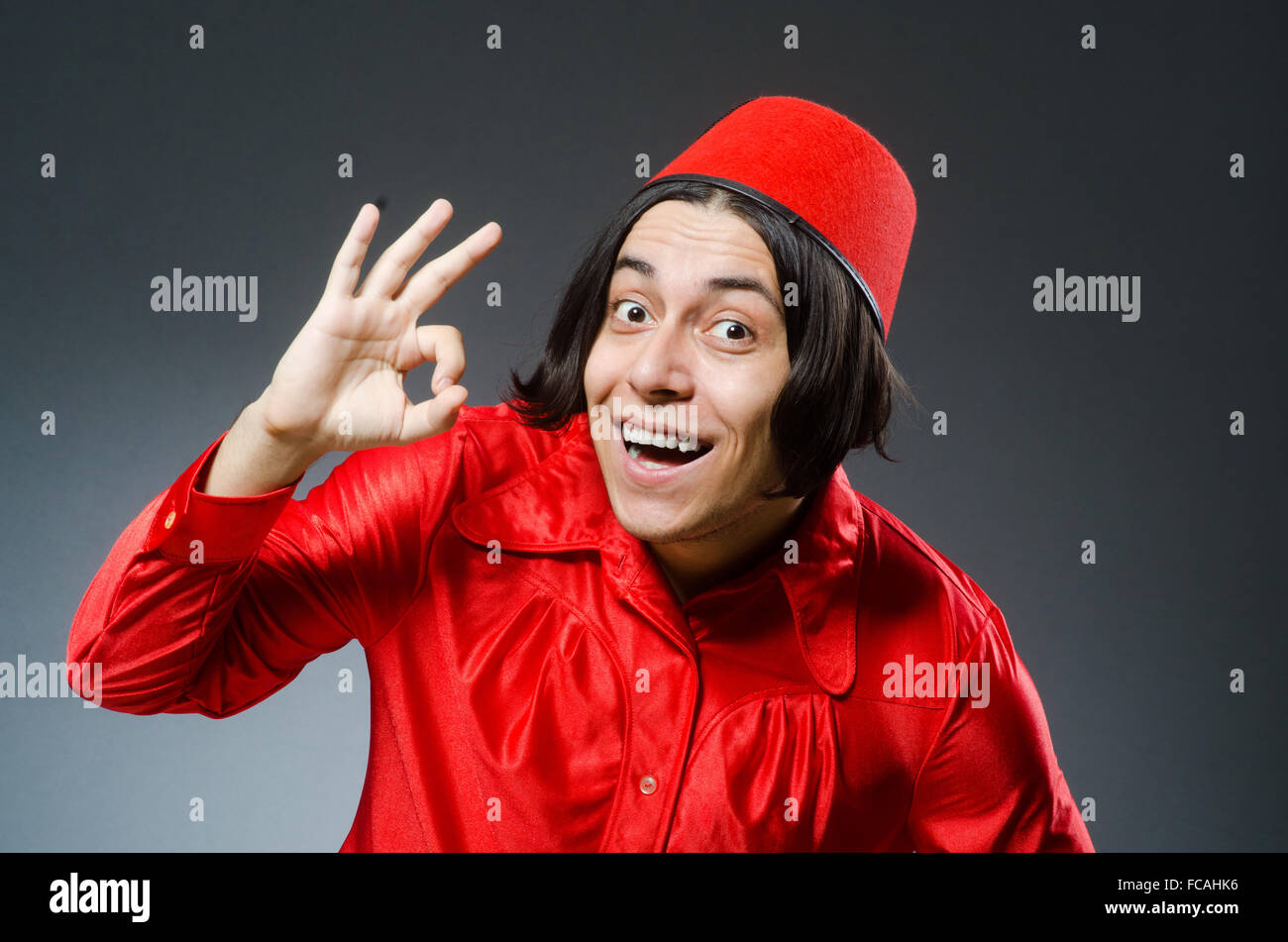 Man wearing red fez hat Stock Photo Alamy