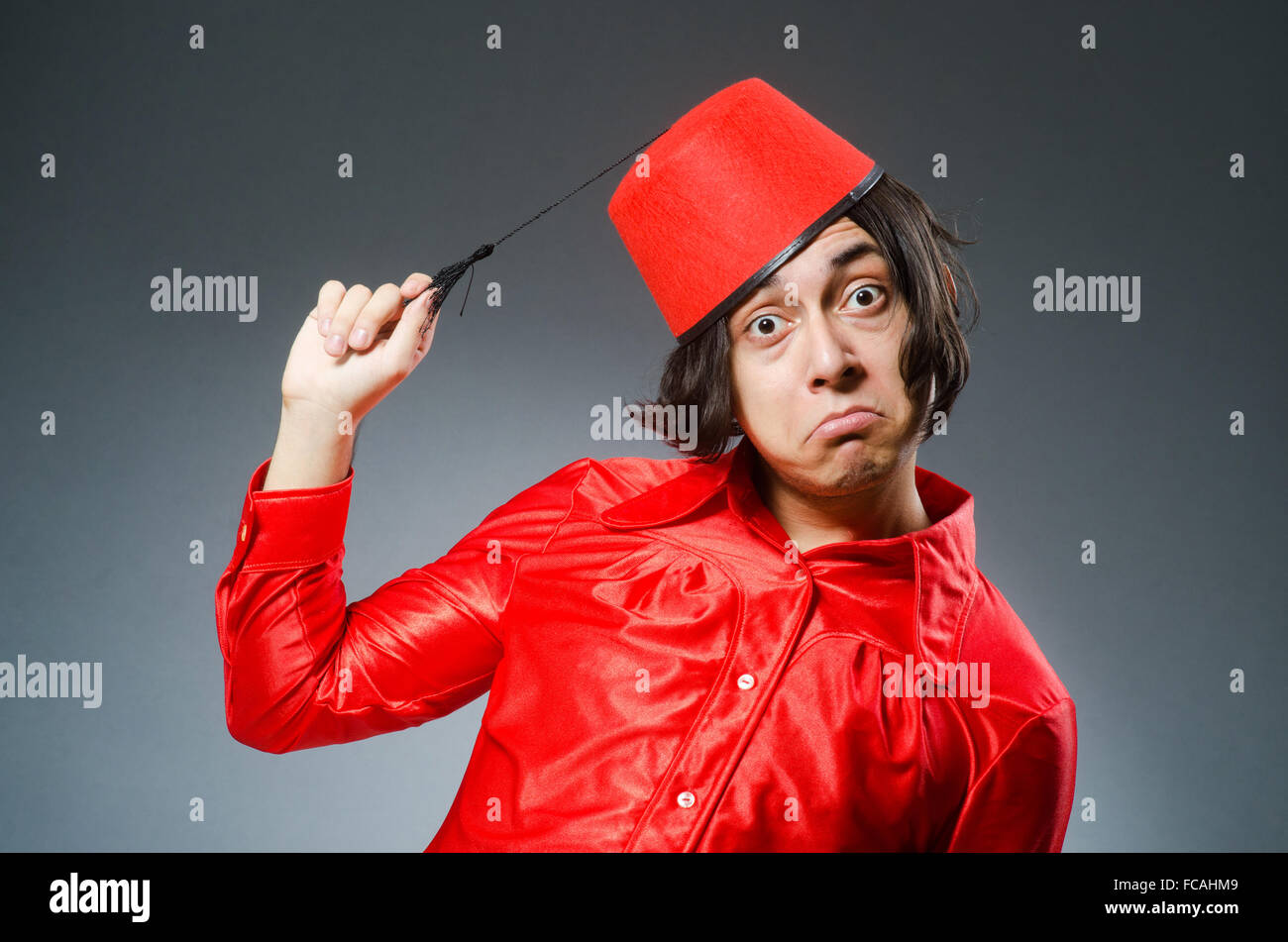 Man wearing red fez hat Stock Photo Alamy