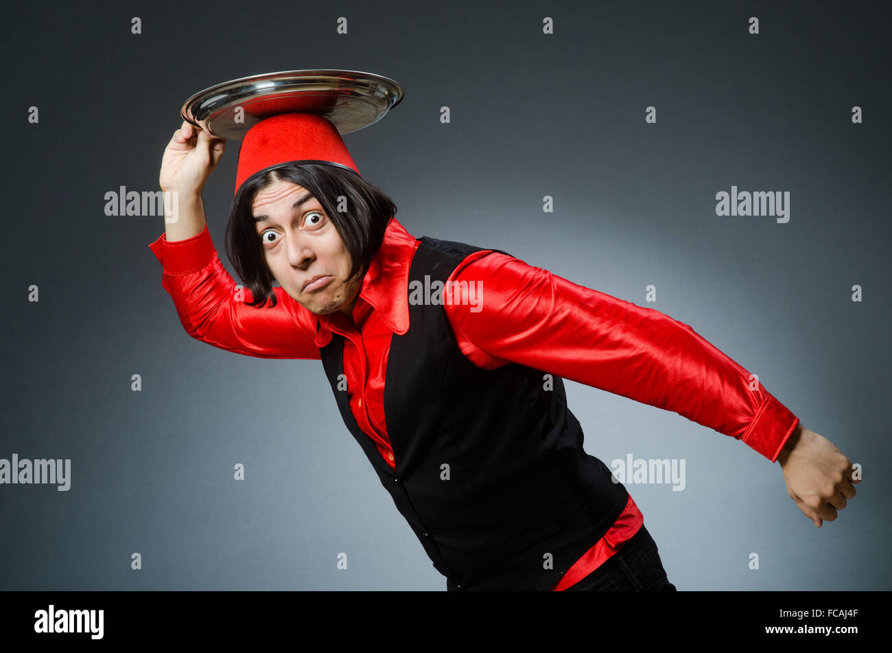 Man wearing red fez hat Stock Photo Alamy