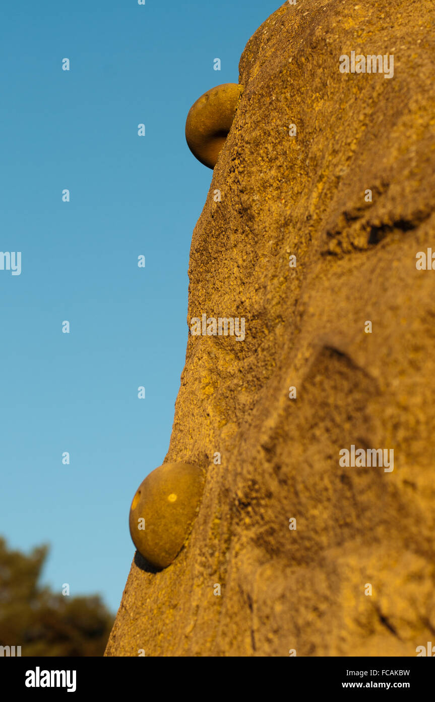 Climbing wall holds lit by sunset glow Stock Photo