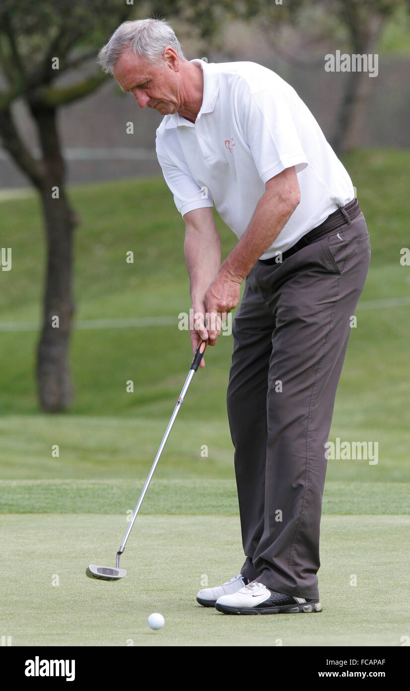 Former soccer player and coach Johan Cruyff hits the ball during a local golf tournament in Mallorca Stock Photo