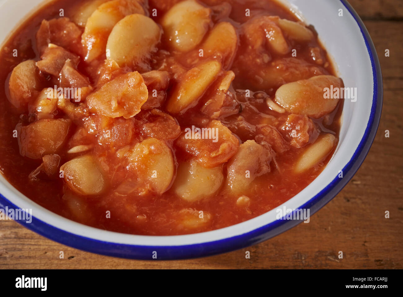 Lima beans baked in tomato sauce Stock Photo