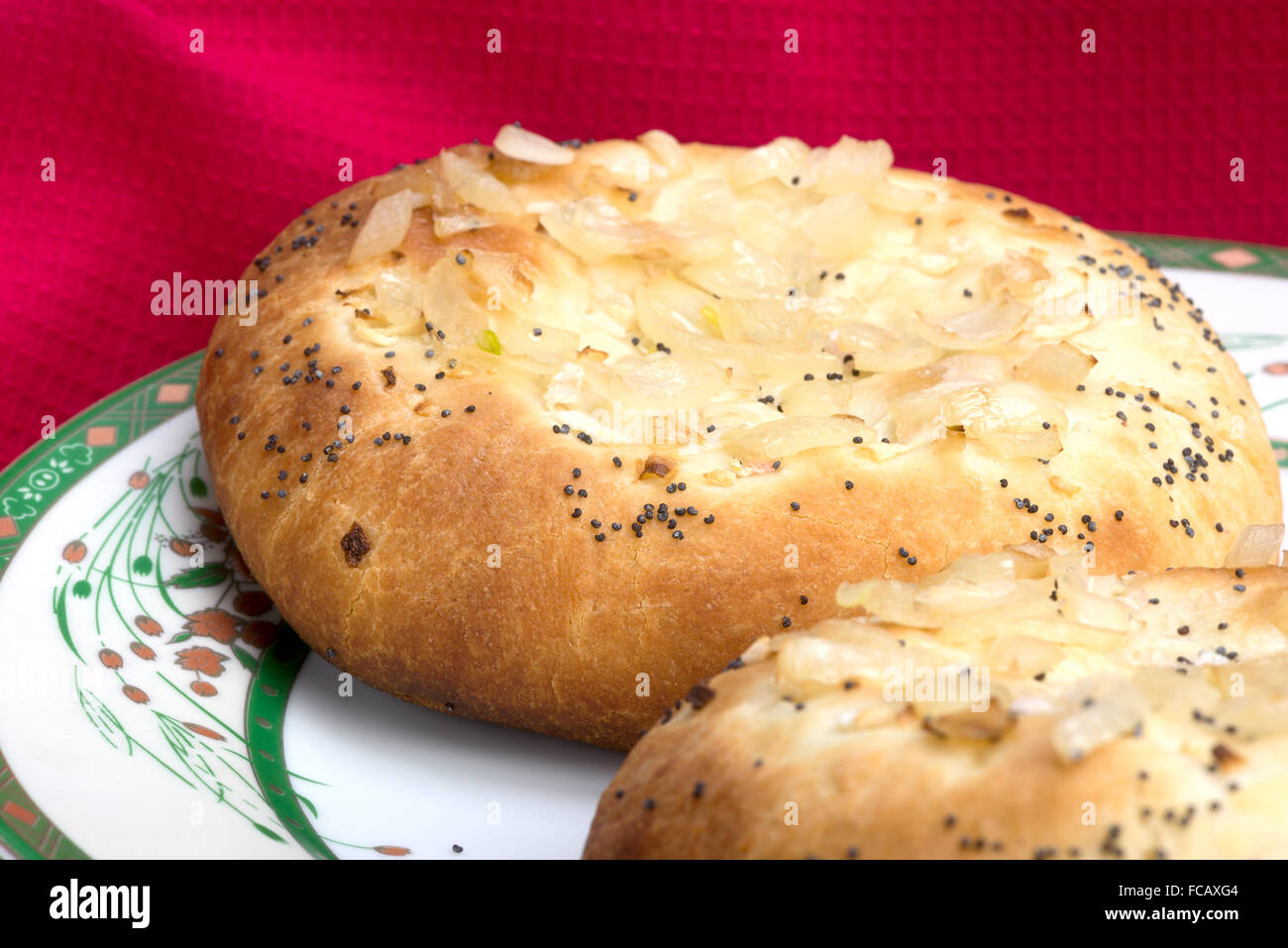 A traditional Ashkenazi Jewish flatbread with onion toppings sprinkled with poppy seeds Stock Photo