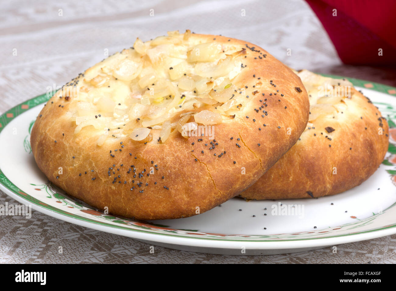 A traditional Ashkenazi Jewish flatbread with onion toppings sprinkled with poppy seeds Stock Photo