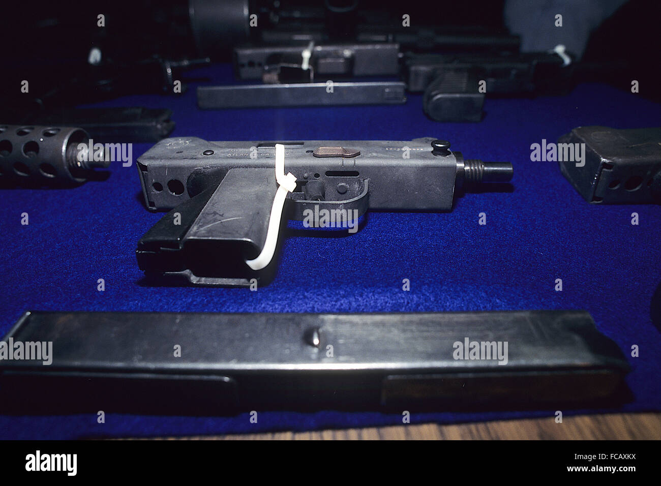 Washington, DC. USA,  1996 Assault weapons on display after being seized off the streets in DC. In the foreground is a 'MAC 10' hand held machine gun that fires a 9mm caliber bullet.  Credit: Mark Reinstein Stock Photo