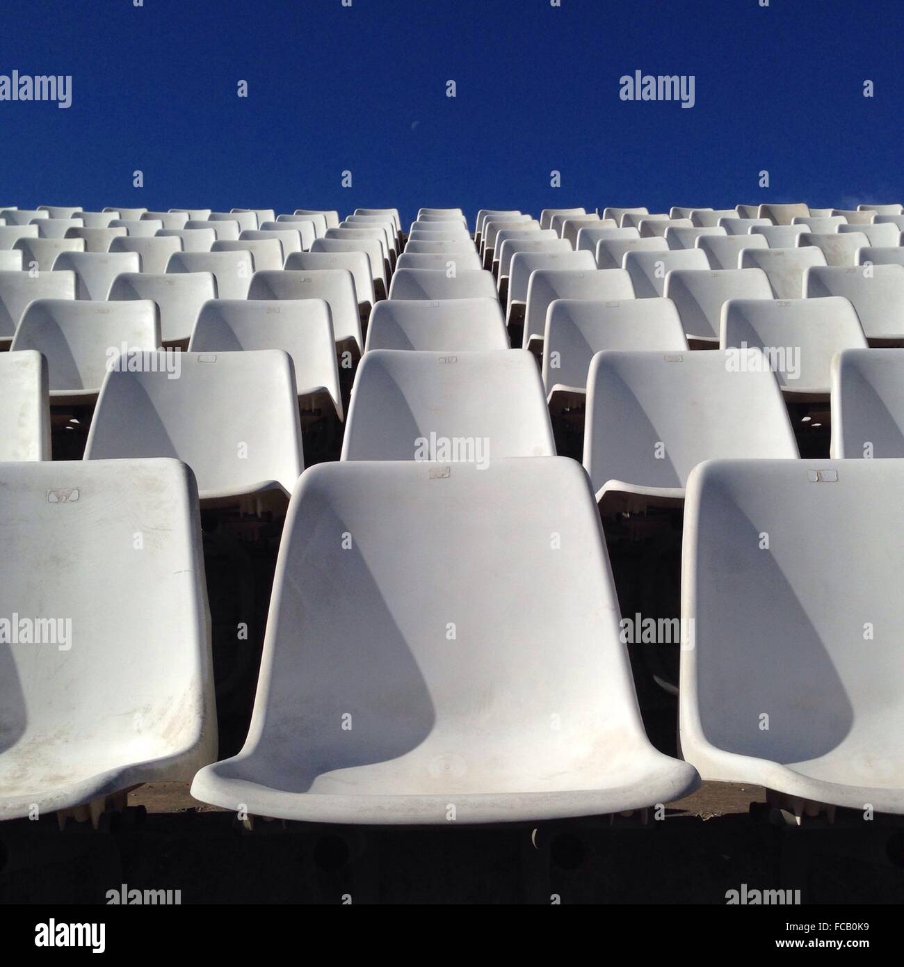 Empty white chairs hi-res stock photography and images - Alamy