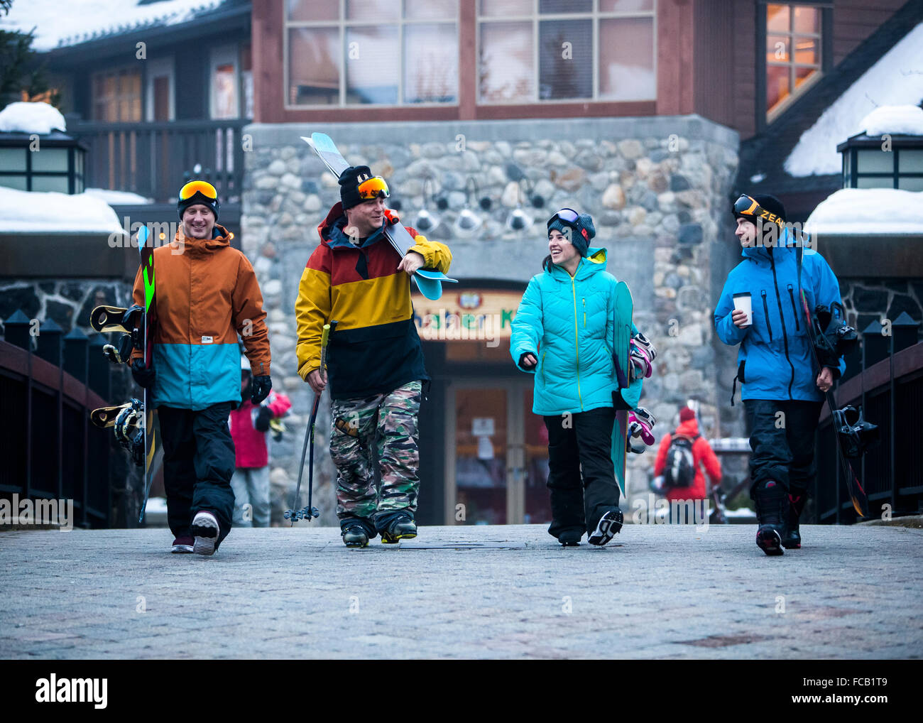 Athletes walking in Ski Resort Base Area Stock Photo