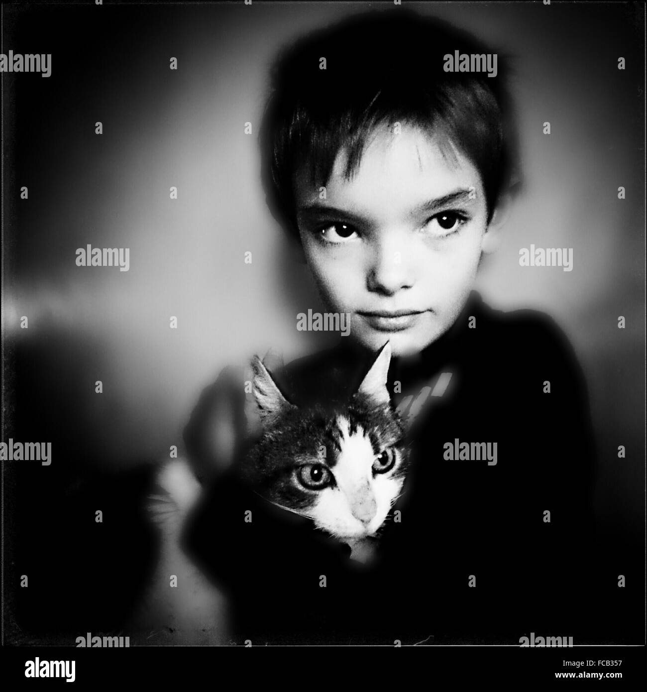 Boy holding cat hires stock photography and images Alamy