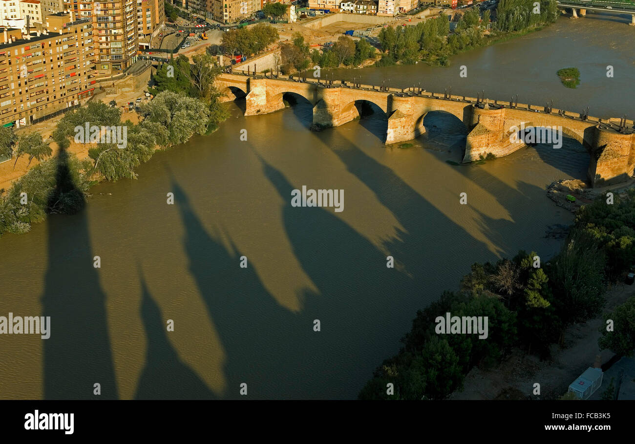 Zaragoza, Aragón, Spain:The shadow of Pilar on the Ebro river and the  Bridge 'de Piedra' Stock Photo