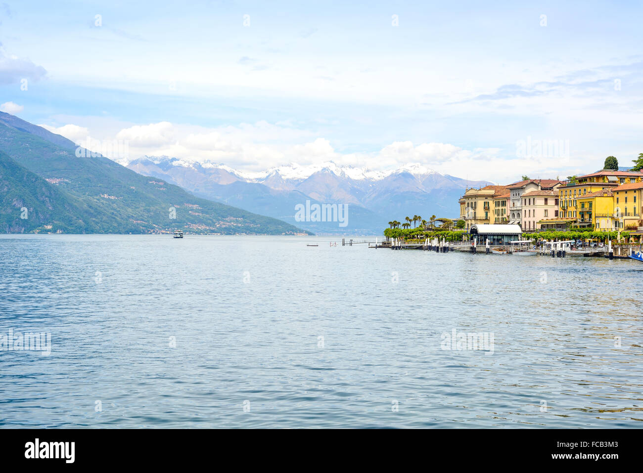 Bellagio town in Como lake district. Landscape with marina and italian traditional lake village. On background Alps mountains co Stock Photo