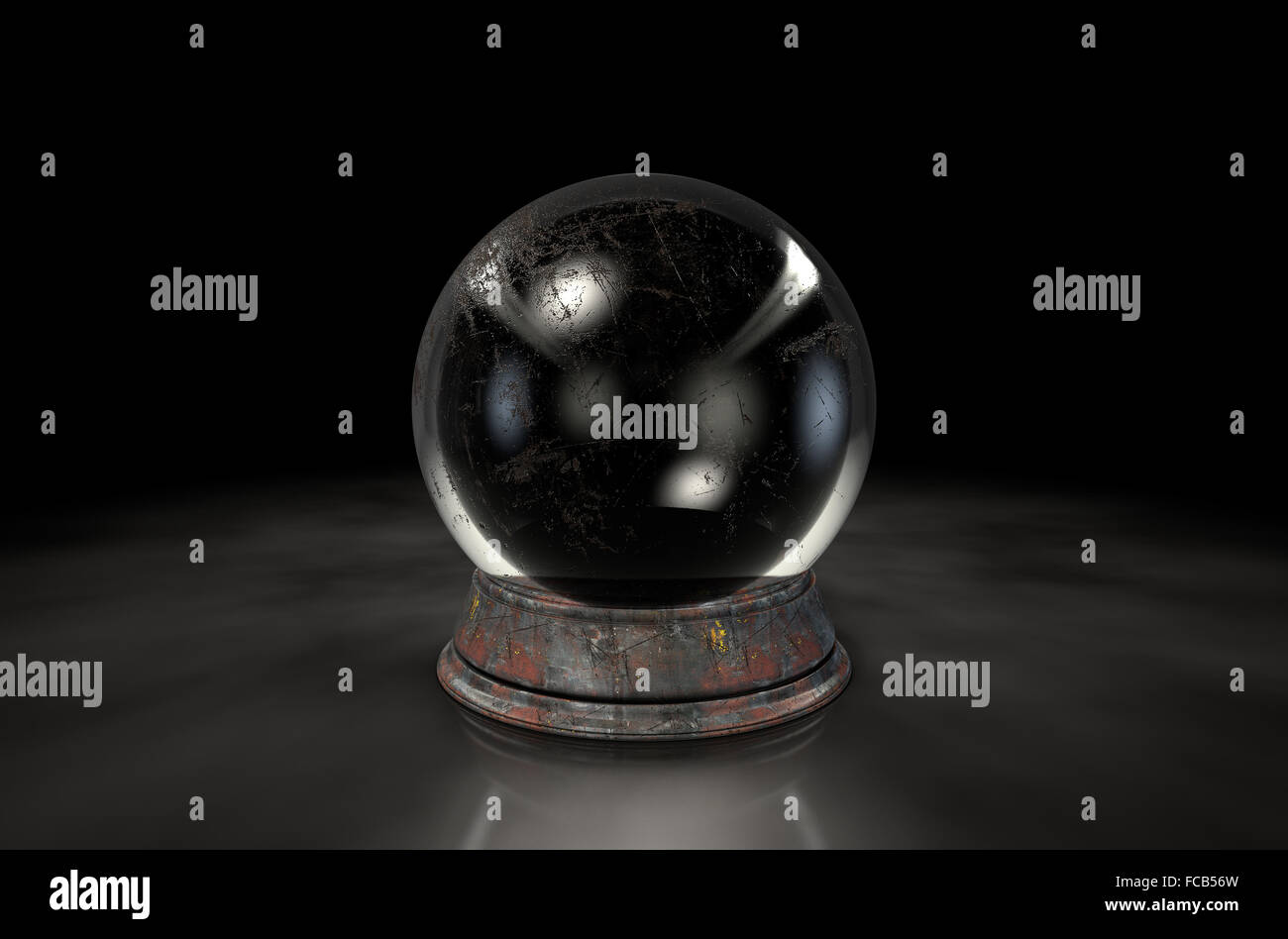 A regular crystal ball on an isolated dark studio background Stock Photo