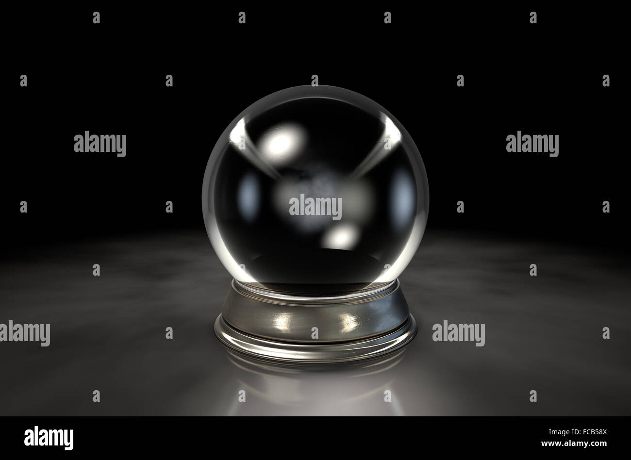 A regular crystal ball on an isolated dark studio background Stock Photo