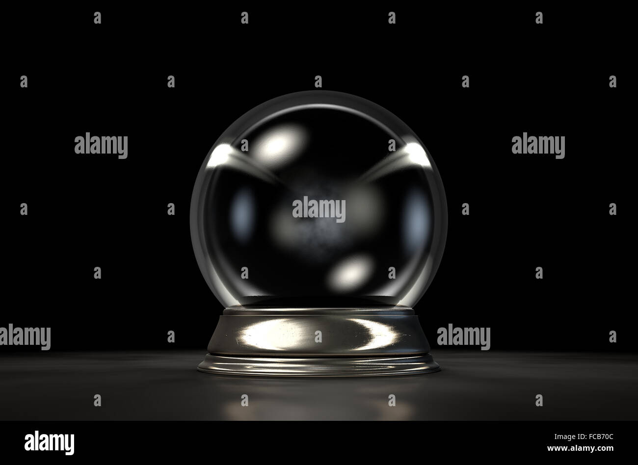 A regular crystal ball on an isolated dark studio background Stock Photo