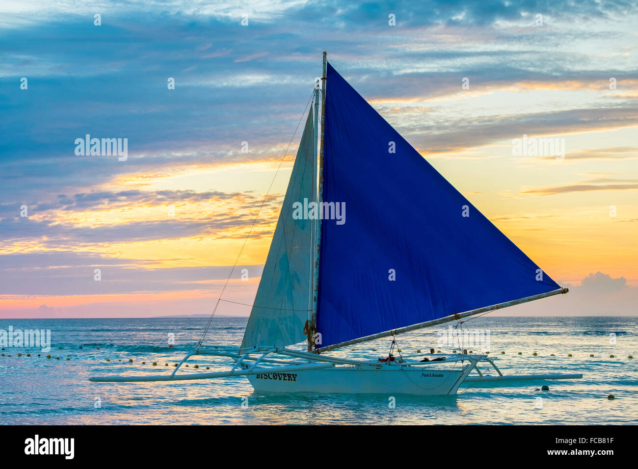 Sailboat at sunset at White Beach, Boracay, Philippines Stock Photo
