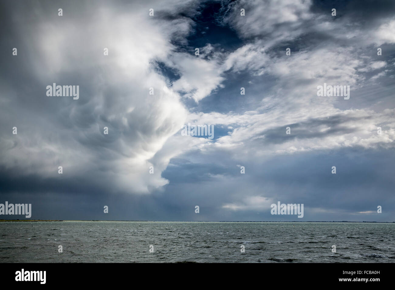 Netherlands, Kerkwerve, The Oosterschelde estuary. Impressive clouds. Stock Photo