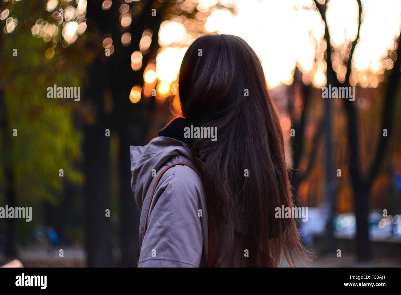 Girl in park in the evening Stock Photo - Alamy