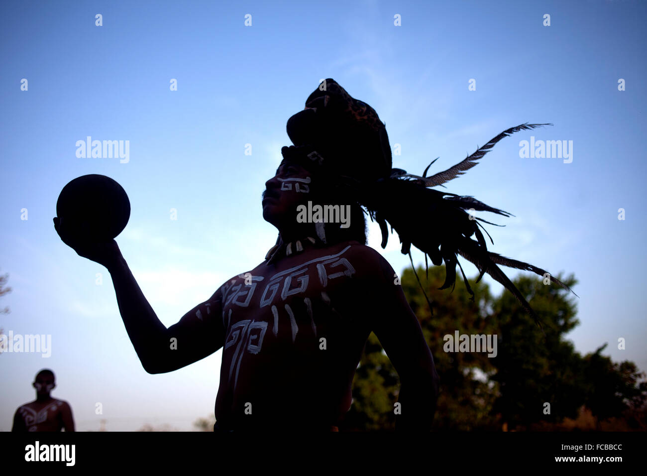 A player of Mayan Ball Game or ®Pok Ta Pok®, holds the ball as he poses in Chapab de las Flores, Yucatan, Mexico Stock Photo