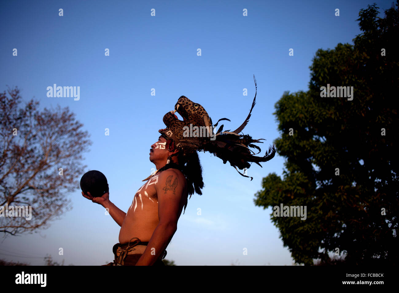 A player of Mayan Ball Game or ®Pok Ta Pok®, holds the ball as he poses in Chapab de las Flores, Yucatan, Mexico Stock Photo