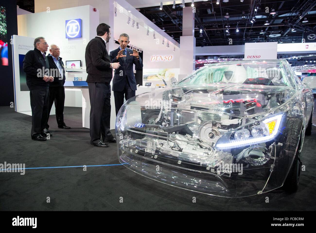 Detroit, Michigan, USA. 20th January, 2016. U.S President Barack Obama looks at the ZF glass car with Bryan Johnson, ZF Communication, during a visit to the 2016 North American International Auto Show at the Cobo Center January 20, 2016 in Detroit, Michigan. Stock Photo
