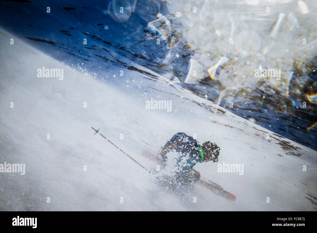 A man skiing on a very very windy day. Stock Photo