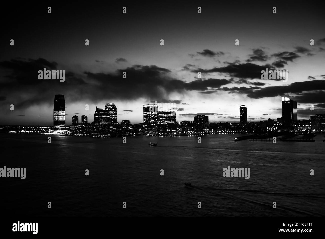 A panoramic view of Jersey City shore at night in Jersey City, New Jersey, USA. Stock Photo