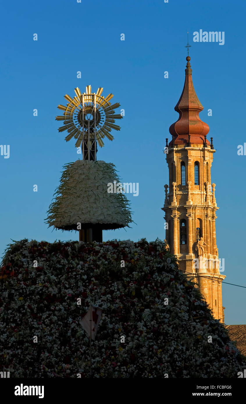 Zaragoza, Aragón, Spain: Virgin of the Pilar in Pilar square during the celebration of El Pilar, and Bell Tower of 'la Seo' Stock Photo